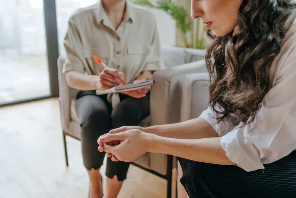 Female patient during consultation or session with psychotherapist.